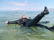 Diver floating in a drysuit